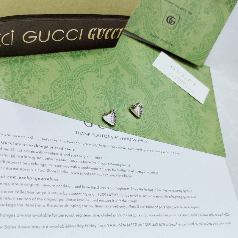 G*u*i earrings
